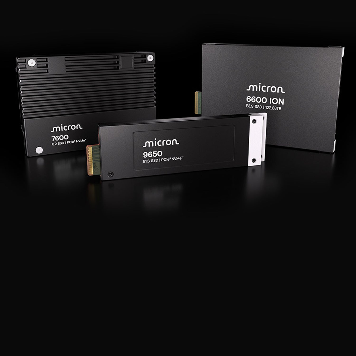 Micron's 9650 SSD and 7600 SSD on a reflective surface in front of Micron's 6600 ION SSD modules 